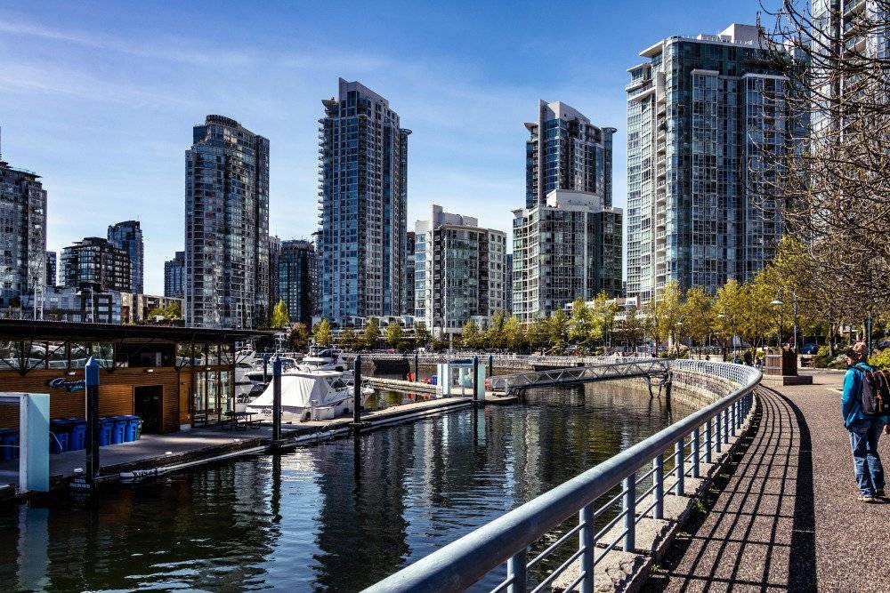 Vancouver, Canada harbor with boats and city skyline.