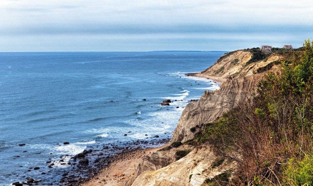 Dramatic cliffs on Block Island, with rugged edges overlooking the vast ocean and rolling waves below